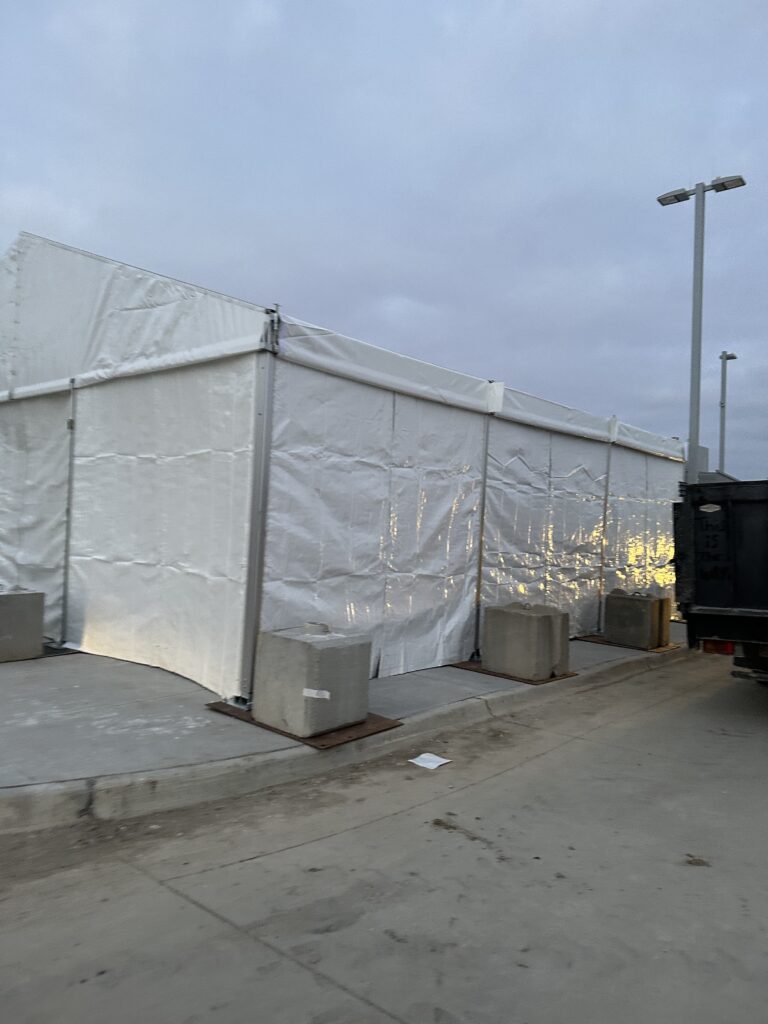 Temporary 30' x 30' Clearspan Tent Structure in Des Moines for Baker Electric over Siemens equipment with finished sidewalls