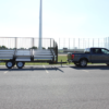 7-Row Towable Bleacher | Seats 107 | 26.5′ Long | Fold-N-Tow attached to truck