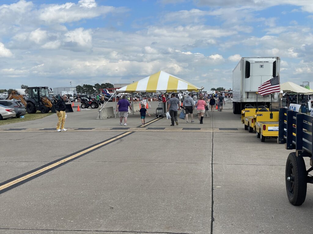 20' x 20' yellow and white frame tent at the Quad city air show set up by Big Ten Rentals
