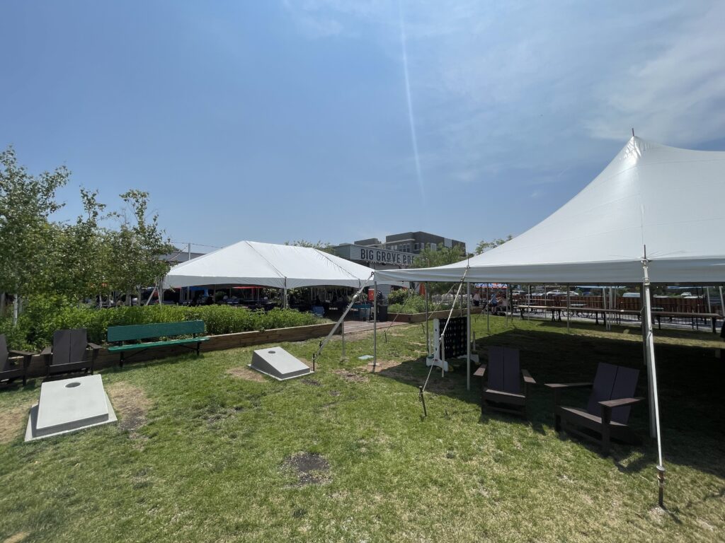 30' x 45' frame event tent left and part of the 30’ x 60' rope and pole on the right at Big Grove Brewery in Iowa City, IA