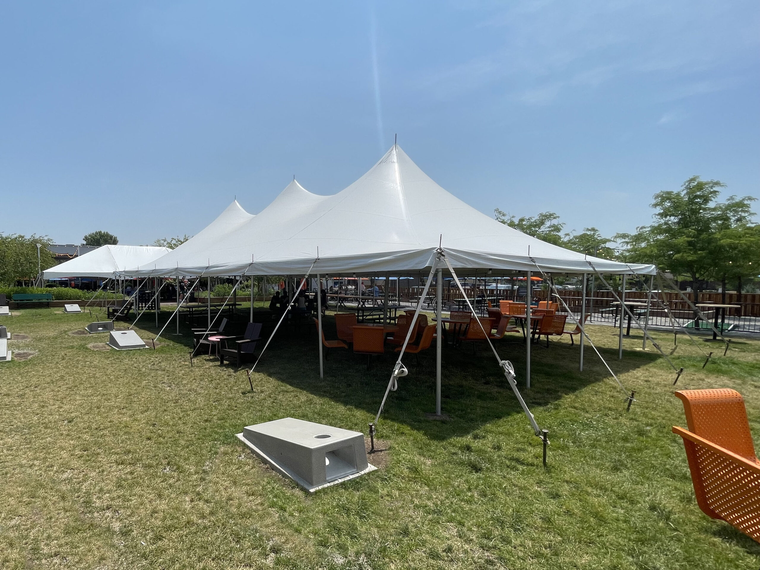 30’ x 60' rope and pole tent in the back is the 30' x 45' frame event tent at Big Grove Brewery in Iowa City, IA