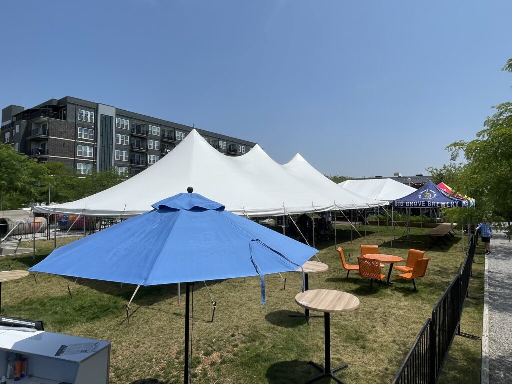Left is a 30’ x 60' rope and pole tent and right is the 30' x 45' frame event tent at Big Grove Brewery in Iowa City, IA