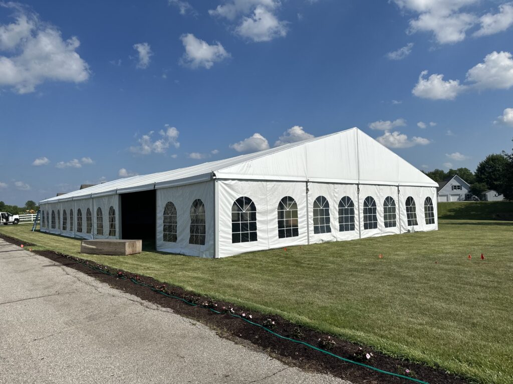 18m x 35m (60′ x 114′) Losberger clearspan temporary event tent structure for a wedding reception in Iowa City near Solon, IA