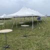 30″ Round Cocktail Tables under and around a 20′ x 60′ Rope and Pole Tent