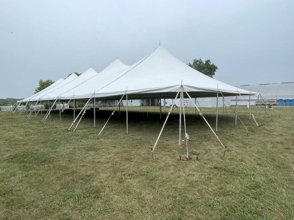 Corner view of 40' x 120' rope and pole tent at the Get WET Get WILD Foam Party at Johnson County Fairgrounds in Iowa City, IA