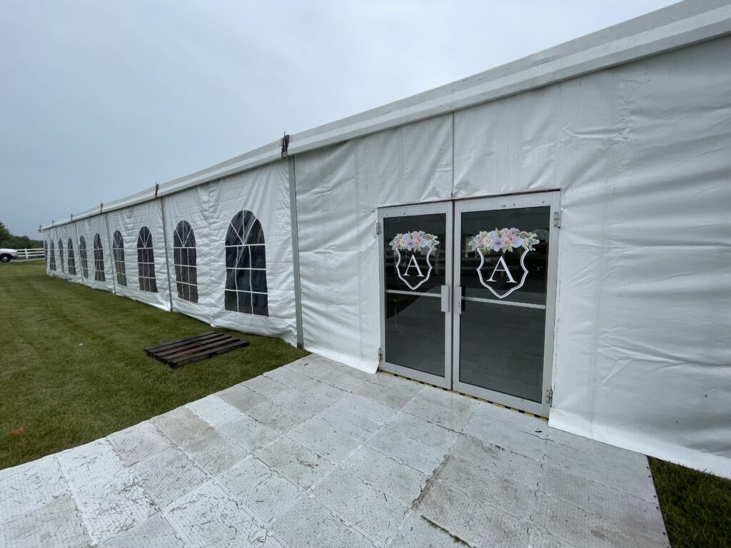 Doors on our 18m x 35m (60′ x 114′) Losberger clearspan temporary event structure set up for a wedding reception