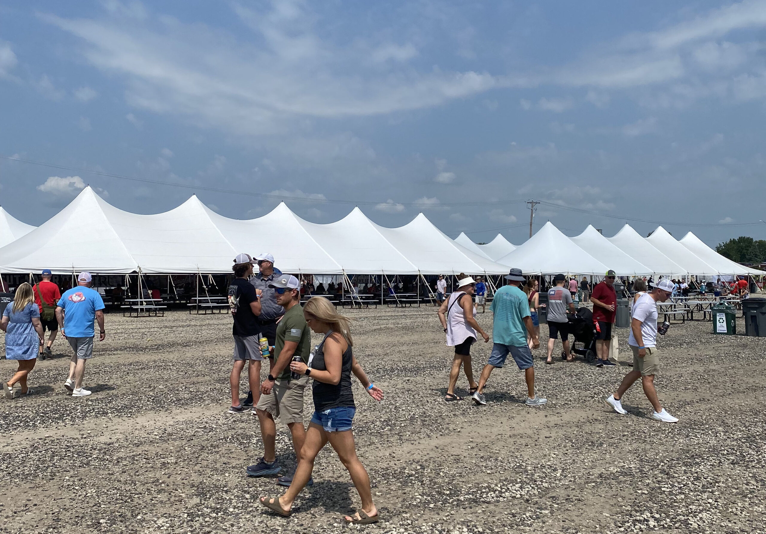 Multiple 40' x 120' rope and pole tents at the Iowa Speedway in Newton, Iowa for Hy-Vee IndyCar Races