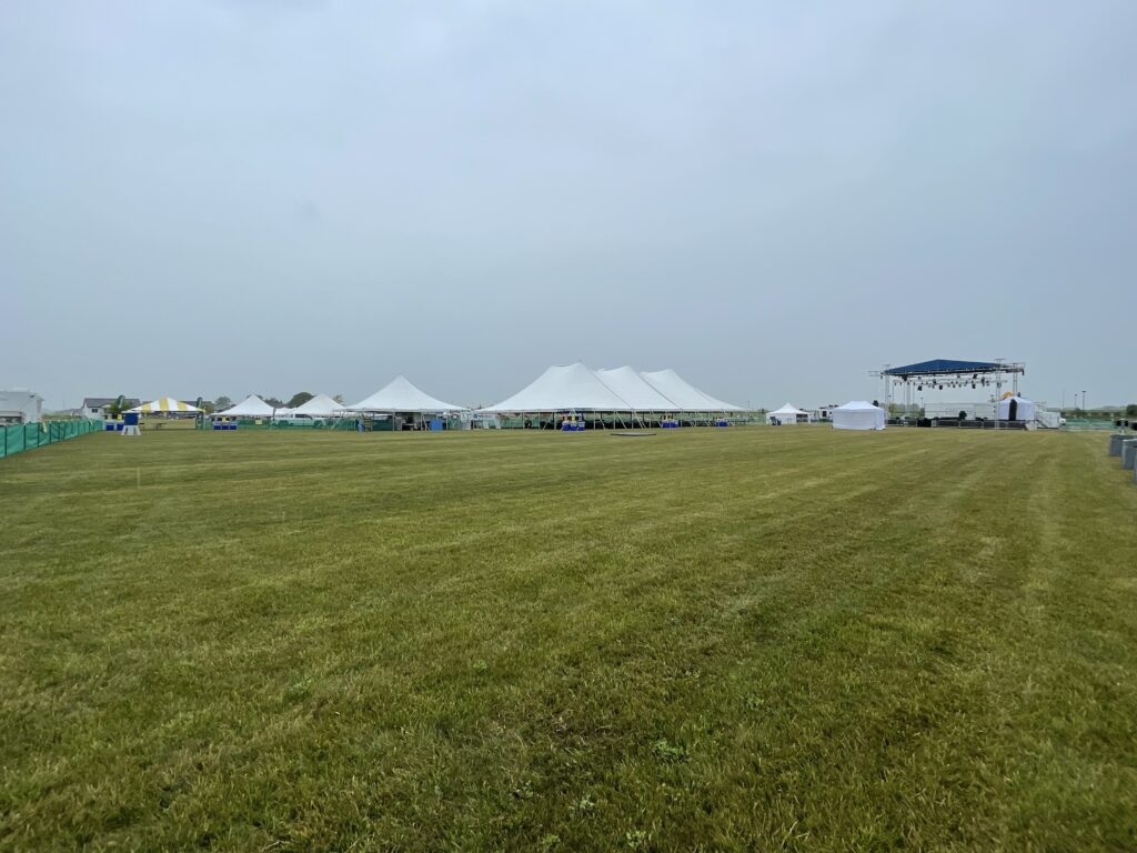Multiple tents and stage at the Blues and BBQ event in North Liberty, IA