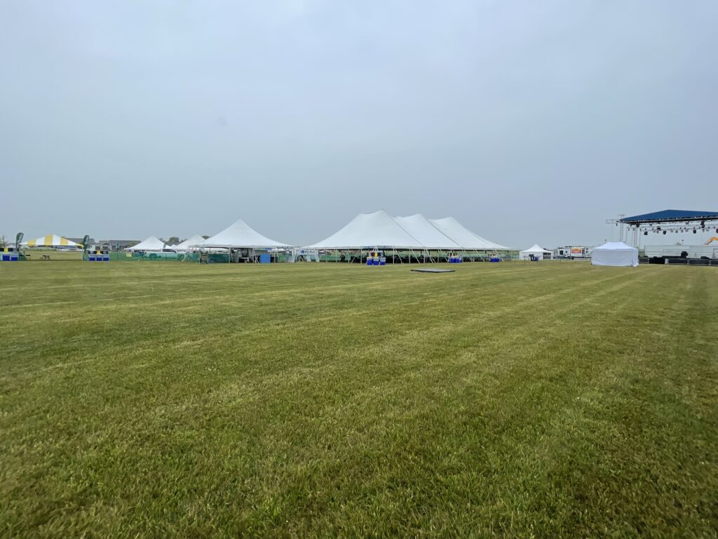 Multiple tents and the stage at Blues and BBQ event in North Liberty, Iowa