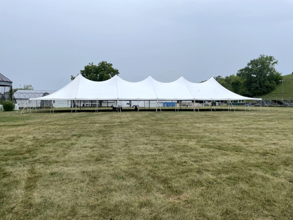 Side view of the 40' x 120' rope and pole tent at the Get WET Get WILD Foam Party at Johnson County Fairgrounds in Iowa City, IA