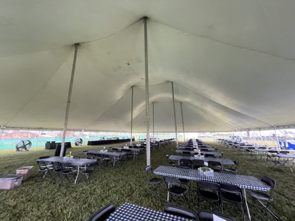 Tables under the 80′ x 120′ Rope and Pole tent
