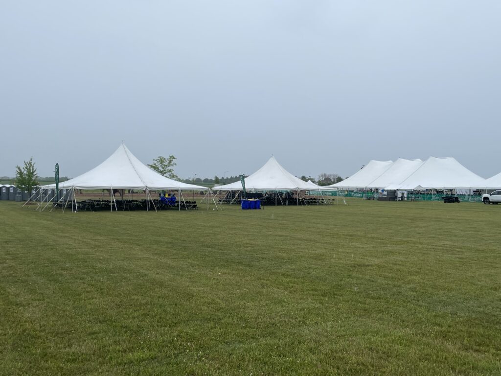 Two 40′ x 40′ Rope and Pole Tents on the left and the 80′ x 120′ twin pole Rope and Pole Tent on the right