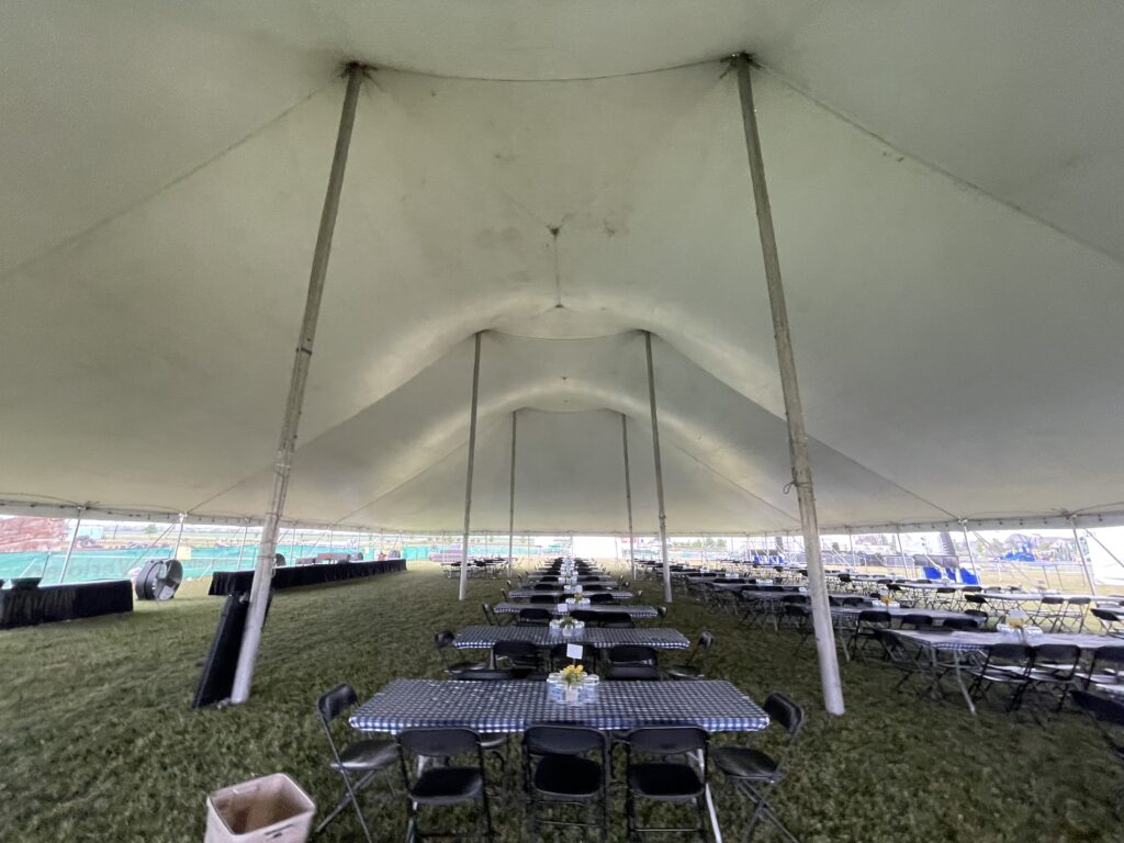 Under the 80′ x 120′ Rope and Pole tent in North Liberty, Iowa