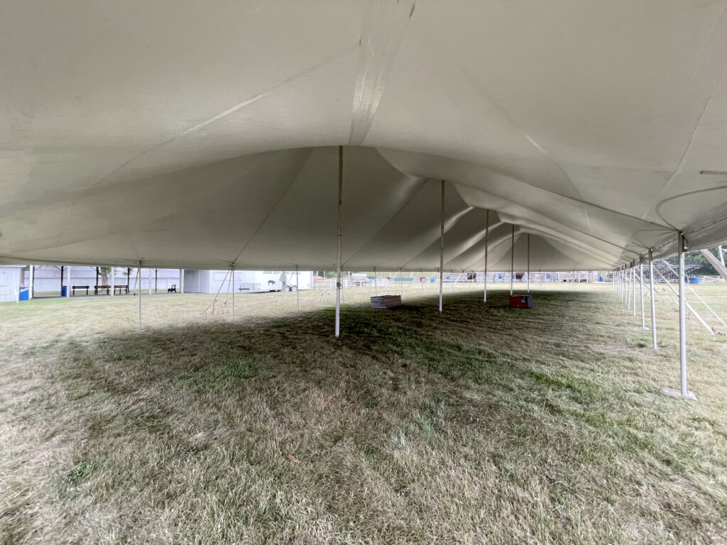 Under the corner of the 40' x 120' rope and pole tent at the Get WET Get WILD Foam Party at Johnson County Fairgrounds in Iowa City, IA
