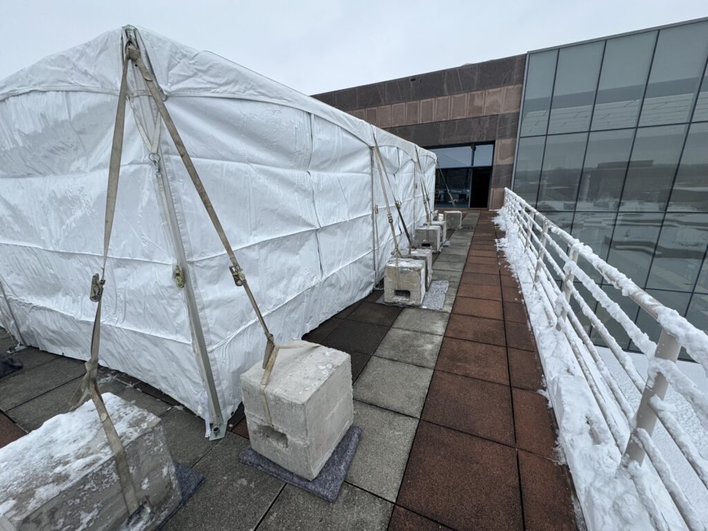 20' x 30' frame tent set up on the 3rd-floor terrace from the State Historical Building in Des Moines, Iowa.