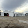 60' x 180' Clearspan Temporary Event Structure for the Special Workhorse Sale Kalona, Iowa in 2024 - Front (three quarter view)