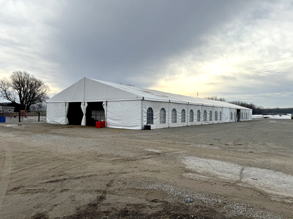 60' x 180' Clearspan Temporary Event Structure for the Special Workhorse Sale Kalona, Iowa in 2024 - Front (three quarter view)