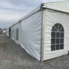 60' x 180' Clearspan Temporary Event Structure for the Special Workhorse Sale Kalona, Iowa in 2024. Outside corner with stakes in the ground.
