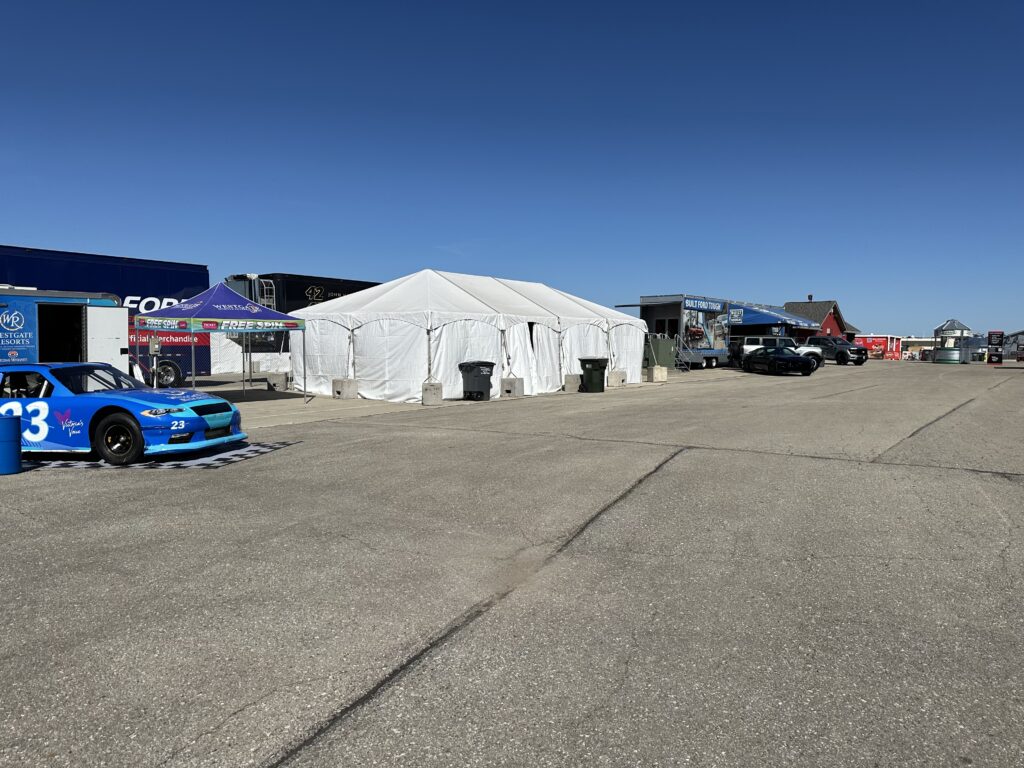 20' x 40' hybrid tent with concrete blocks - 2024 NASCAR Race Weekend at Iowa Speedway in Newton, Iowa