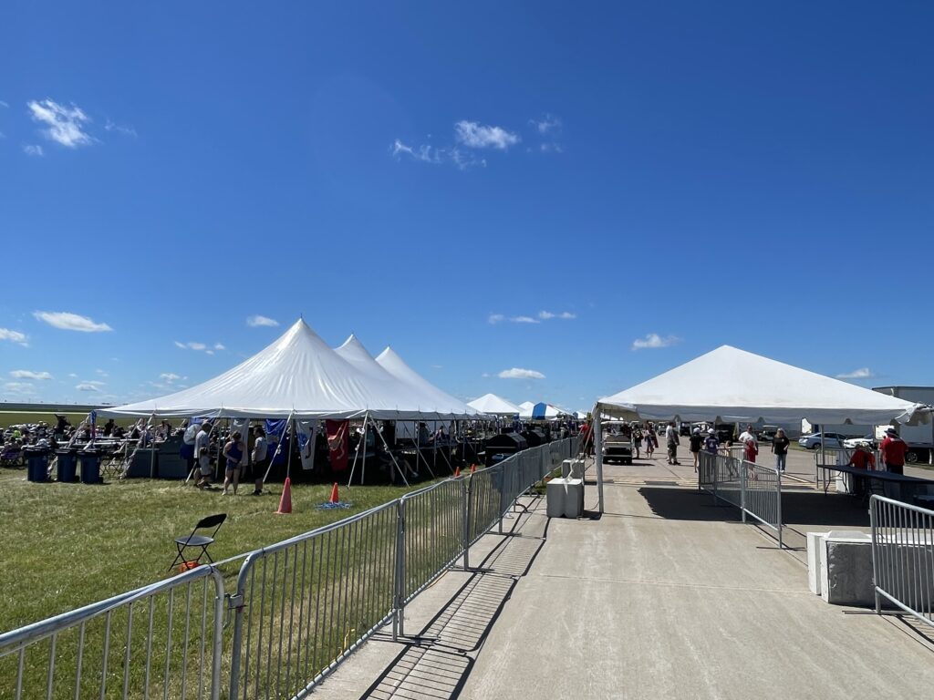 30' x 60' rope and pole tent and 20' x 20' frame tent at Quad City Air Show 2024 in Davenport, IA. Hospitality Chalet