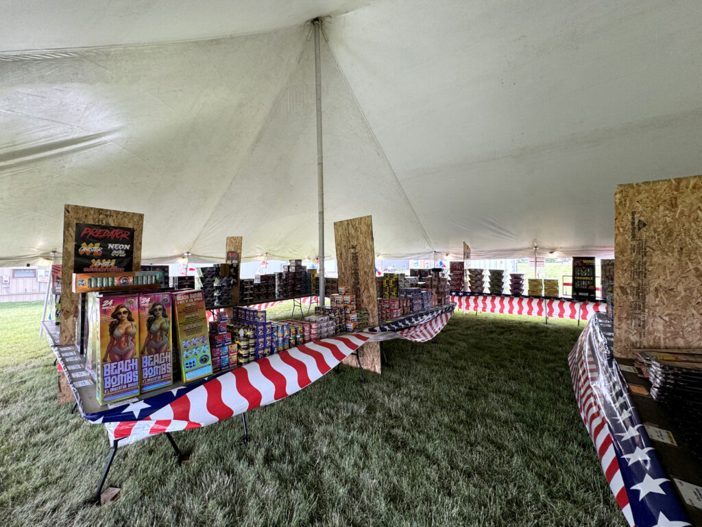 Fireworks for sale under the fireworks tent in North Liberty, IA. 30' x 40' Rope and Pole Tent.