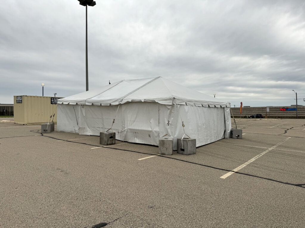 Fireworks tent - 20' x 30' frame tent with Block and Roll tent ballast and Tables in Dubuque, Iowa for Phantom Fireworks (corner)