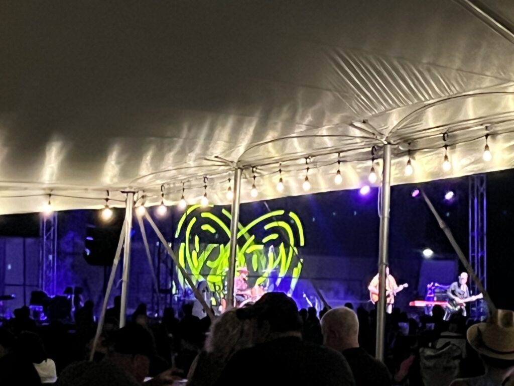 Under an event tent at the 2024 North Liberty Blues & BBQ