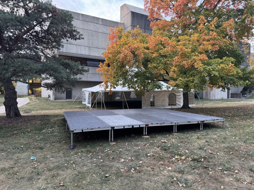 16' x 20' stage with 30' x 40' rope and pole event tent at University of Iowa College of Dentistry.