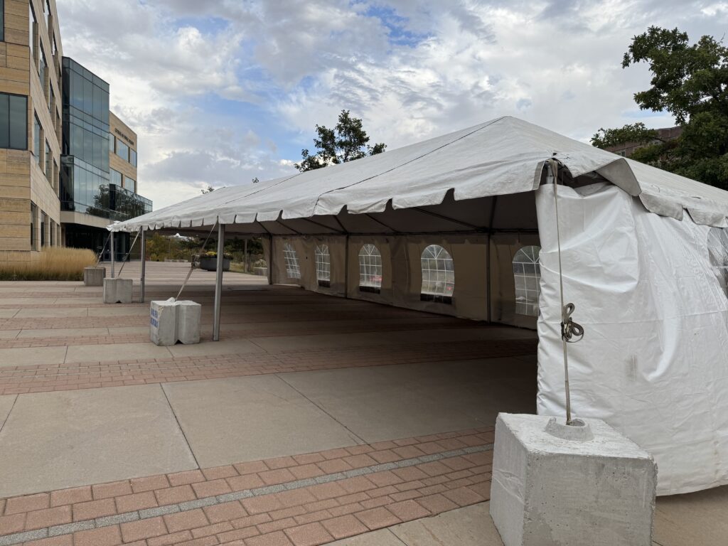 Corner of 20' x 60' Frame Event Tent for Homecoming at University of Iowa College of Public Health with 1,200 blocks.