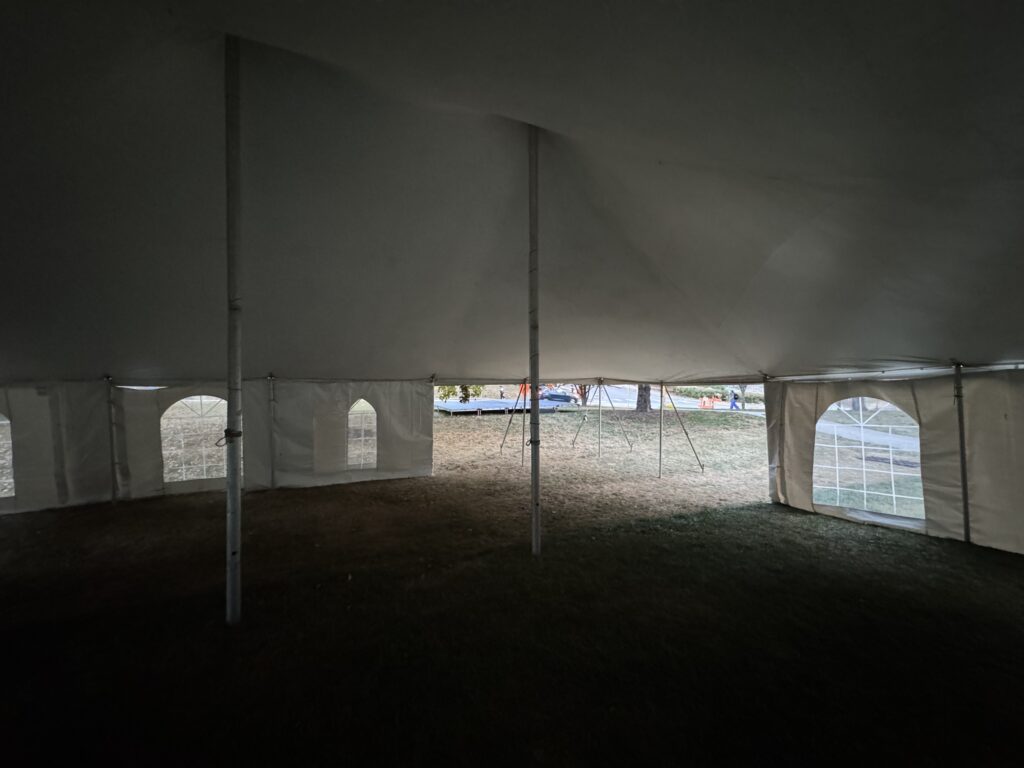 Under 30' x 40' rope and pole event tent at University of Iowa College of Dentistry looking at stage.