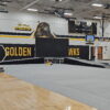 Temporary stage with accessibility ramps in the gymnasium at Mid Prairie High School in Wellman, IA