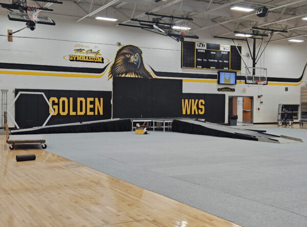 Temporary stage with accessibility ramps in the gymnasium at Mid Prairie High School in Wellman, IA Temporary stage with accessibility ramps in the gymnasium at Mid Prairie High School in Wellman, IA