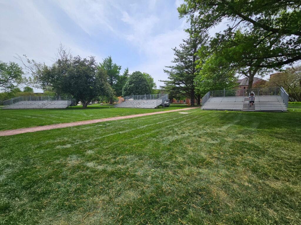 Two 10-Row, 45' Towable Bleachers and one 10-Row 30′Towable Bleacher for Outdoor Commencement at Grinnell College in Grinnell, Iowa
