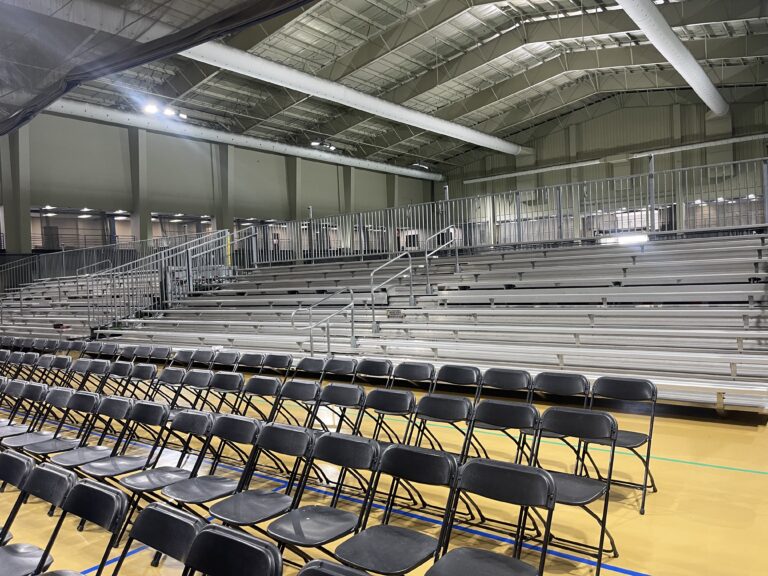Two of our 45’ Towable Bleachers and 1,450 Black Chairs to William Penn University Graduation in the back.