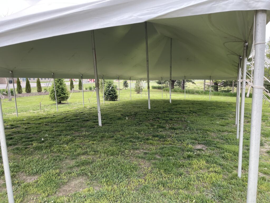 Under a 30' x 60' Rope & Pole Tent in Iowa City, Iowa.