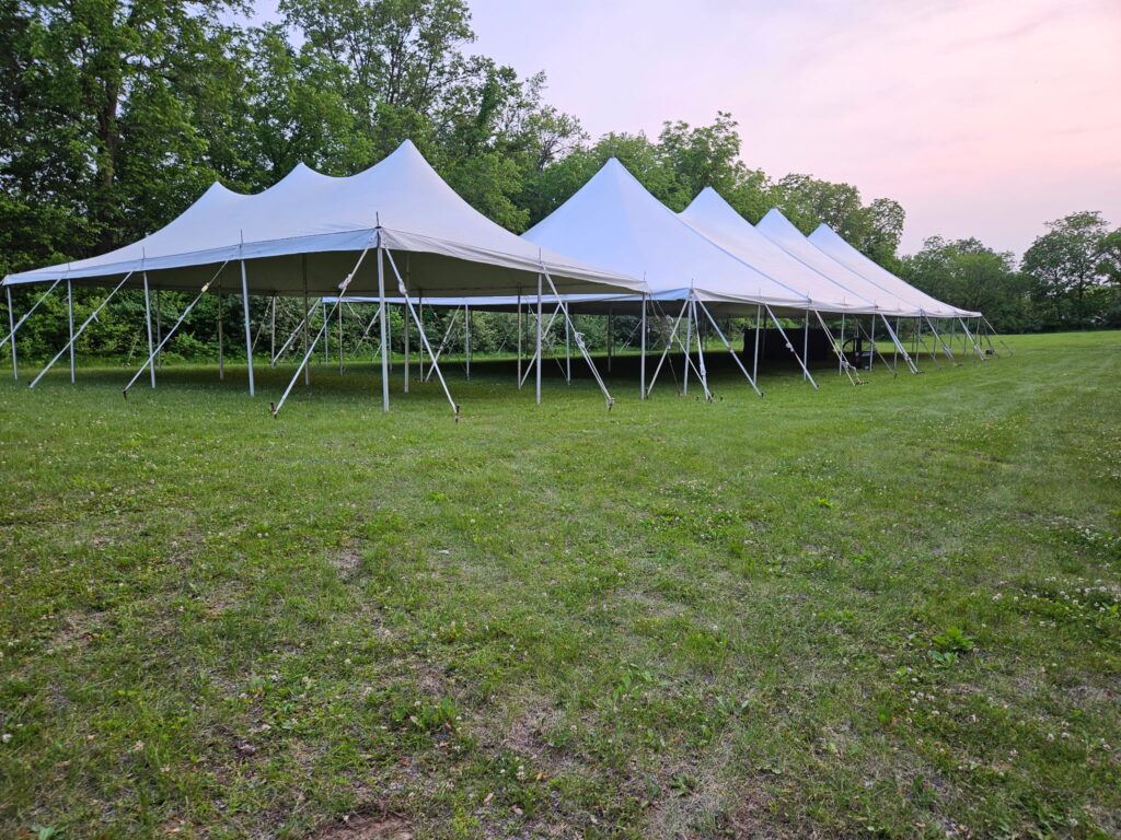 20' x 40' rope and pole tent (left) and a 40' x 100' Fred’s rope and pole tent (right)