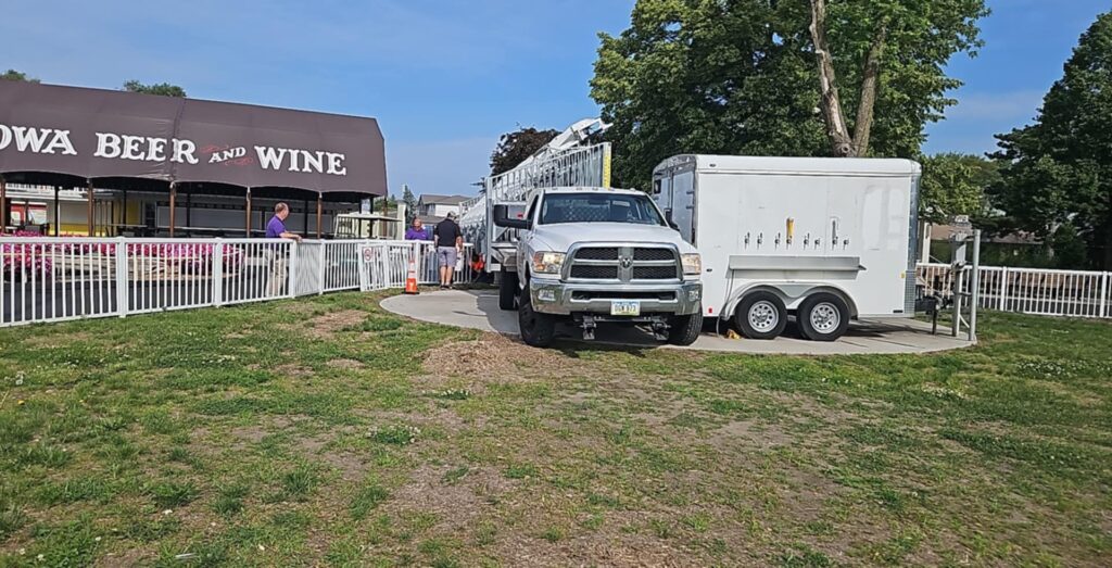 Threading the needle as we deliver the 45' Towable Bleacher at Adventureland Resort for the Jetpack Flying Water Circus in Altoona, Iowa