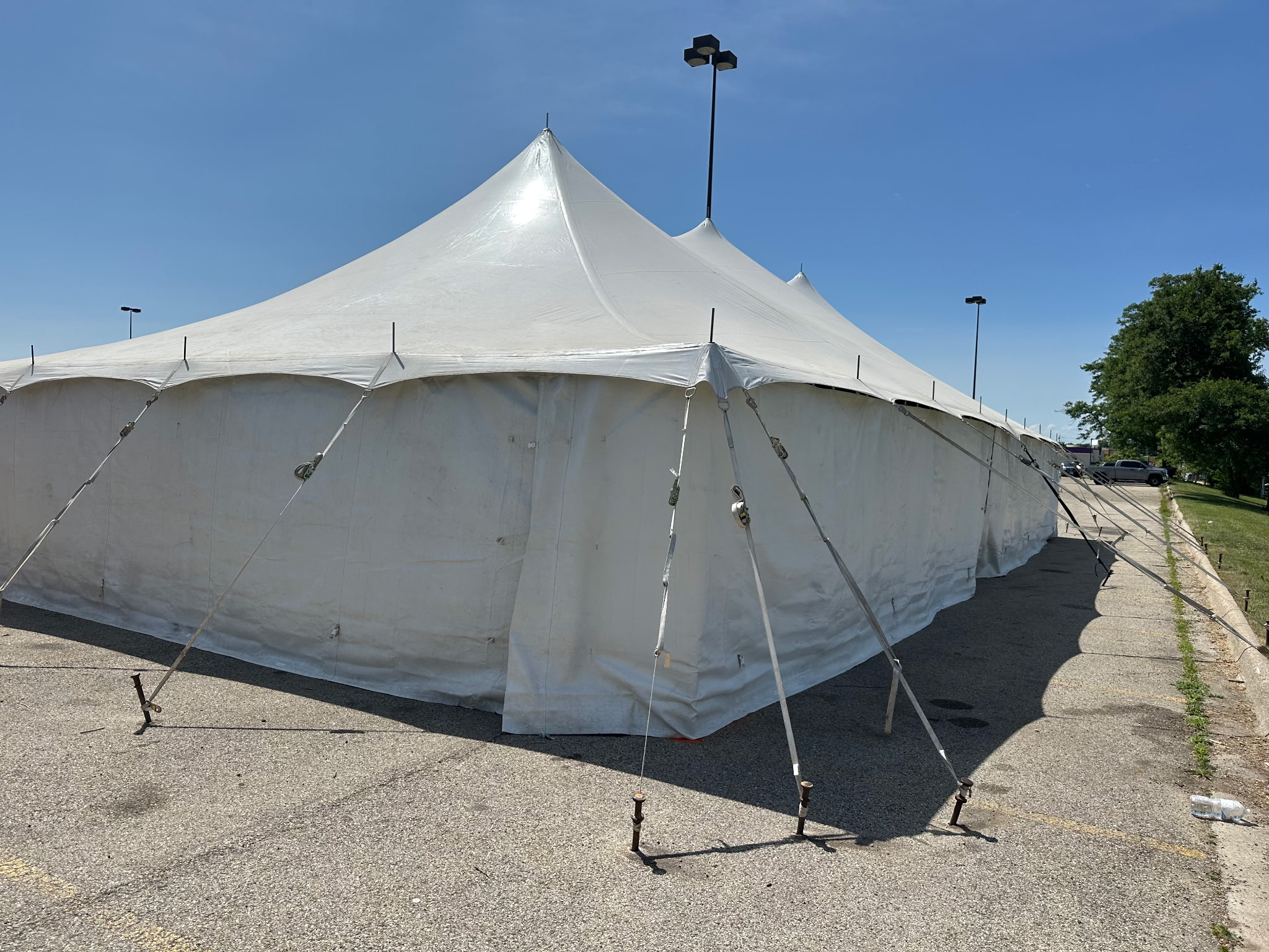 30' x 60' Rope & Pole Tent for Cornellier Fireworks, Rockford, Illinois. Set up in a parking lot.