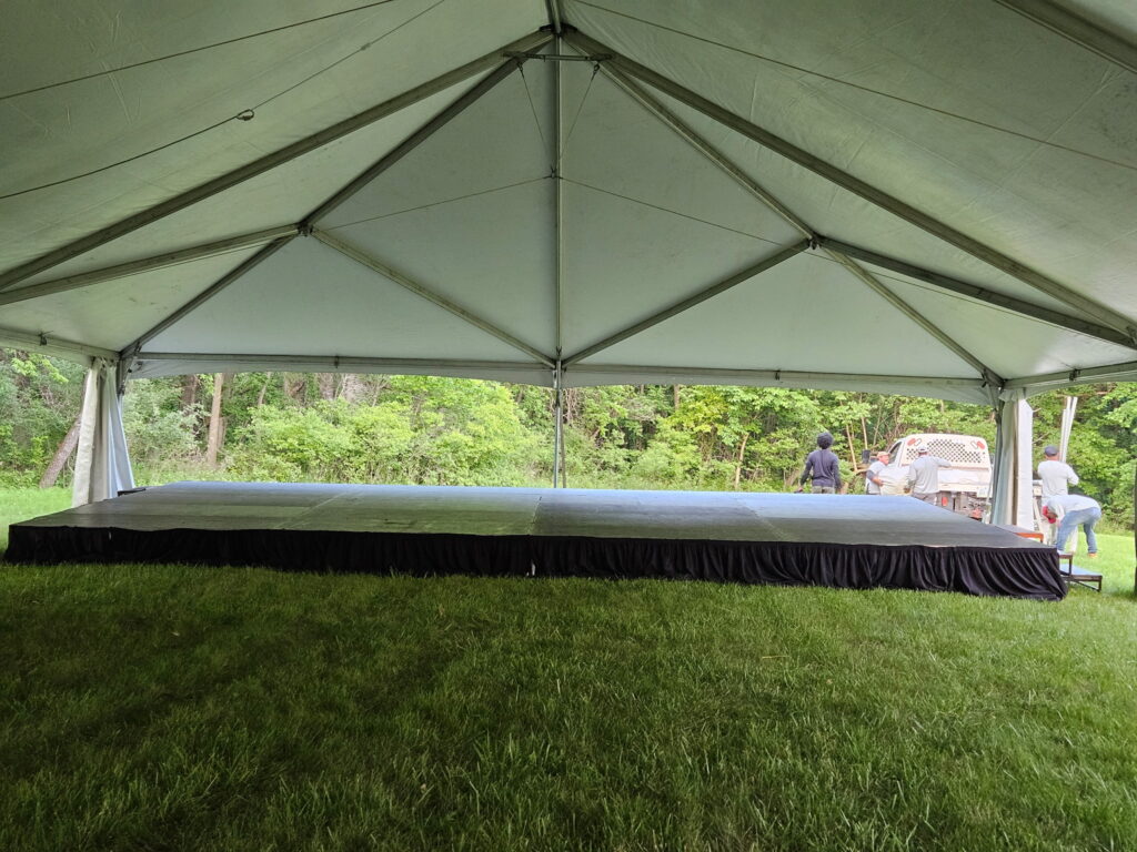 Stage under 40' x 120' Hybrid Jumbo Track Tent with stage at the end at Quad City Hindu Temple in Rock Island, Illinois