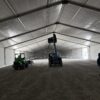 Adding UFO lights using a telehandler under the 60' x 230' (18m x 70m) Losberger clearspan in Kalona, Iowa - Kalona Special Workhorse Sale