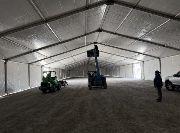 Adding UFO lights using a telehandler under the 60' x 230' (18m x 70m) Losberger clearspan in Kalona, Iowa - Kalona Special Workhorse Sale Adding UFO lights using a telehandler under the 60' x 230' (18m x 70m) Losberger clearspan in Kalona, Iowa - Kalona Special Workhorse Sale