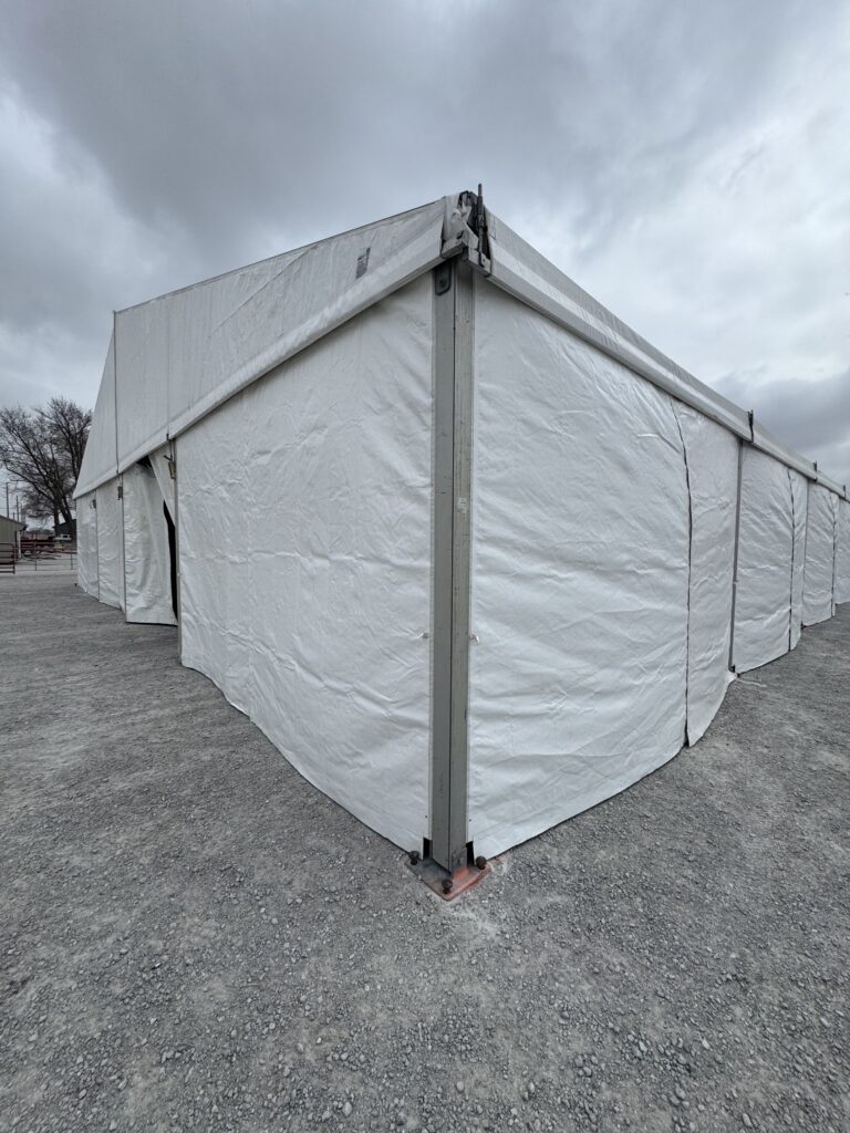 Corner of 60' x 230' (18m x 70m) Losberger Clearspan Event Structure-Tent at the Kalona Sales Barn