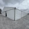 Corner of 60' x 230' (18m x 70m) Losberger Clearspan Event Structure-Tent at the Kalona Sales Barn (back)