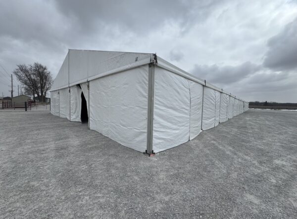 Corner of 60' x 230' (18m x 70m) Losberger Clearspan Event Structure-Tent at the Kalona Sales Barn (back) Corner of 60' x 230' (18m x 70m) Losberger Clearspan Event Structure-Tent at the Kalona Sales Barn (back)