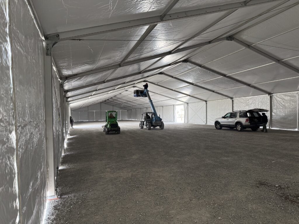 Crew under the 60' x 230' (18m x 70m) Losberger clearspan in Kalona, Iowa - Kalona Special Workhorse Sale