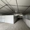 Under 60' x 230' (18m x 70m) Losberger Clearspan Event Structure with horse stalls at the Kalona Sales Barn.