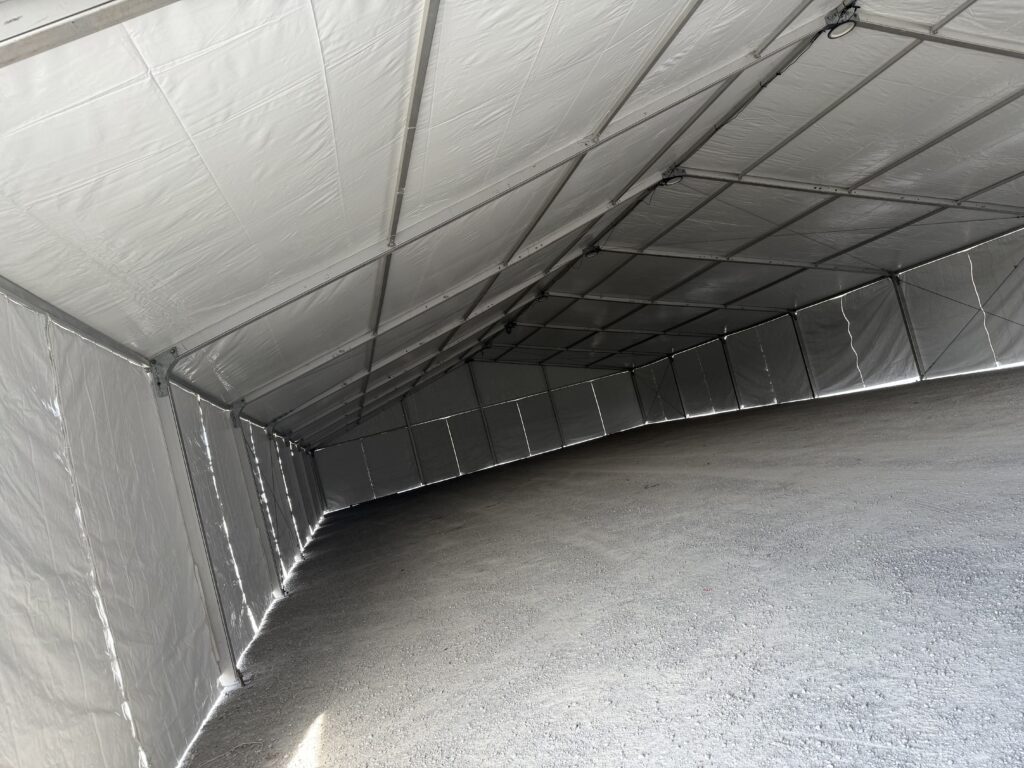Under the 60' x 230' (18m x 70m) Losberger clearspan in Kalona, Iowa - Kalona Special Workhorse Sale