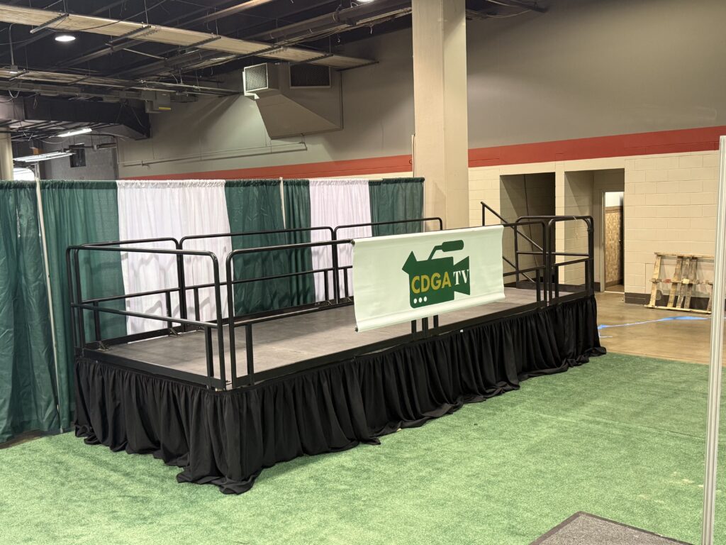 8' x 20' x 32" Press Riser at the Chicago Golf Show® in Rosemont, Illinois. Inside of Donald E. Stephens Convention Center.