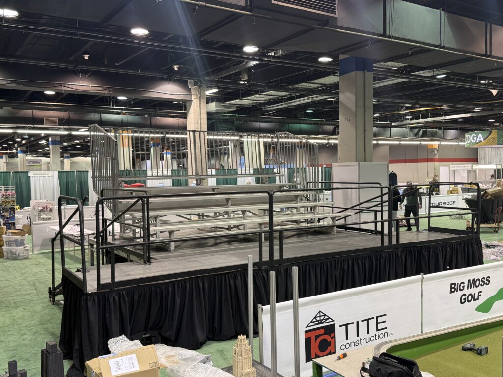 Elevated bleacher (5-row breakdown bleacher that seats 50 people on a 16' x 16' x 34" stage) at the Chicago Golf Show® in Rosemont, Illinois