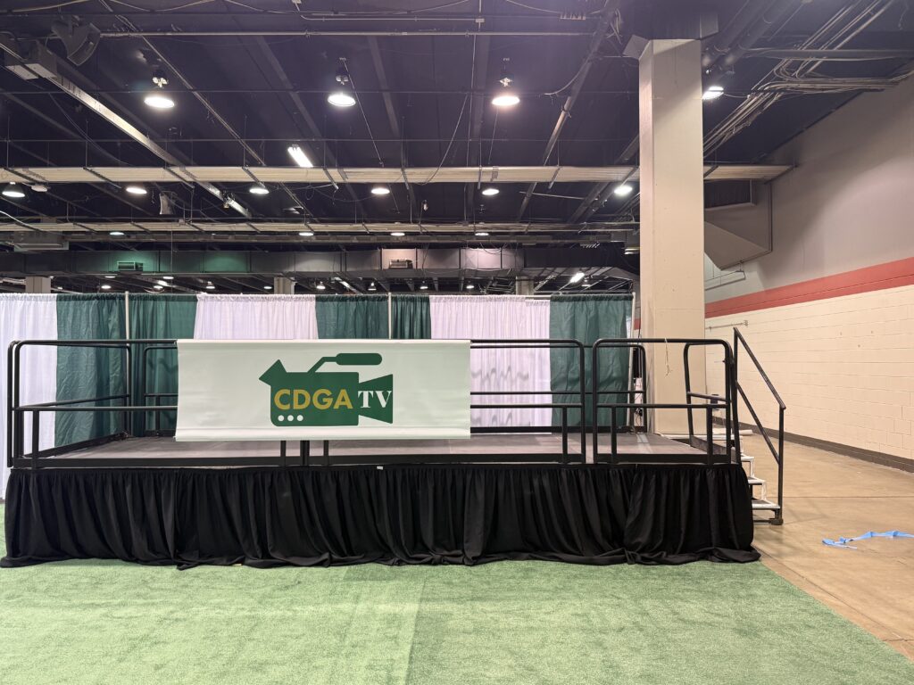 Stairs on the side of 8' x 20' x 32" Press Riser at the Chicago Golf Show® in Rosemont, Illinois.